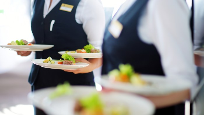 A food handler sneezes and then returns